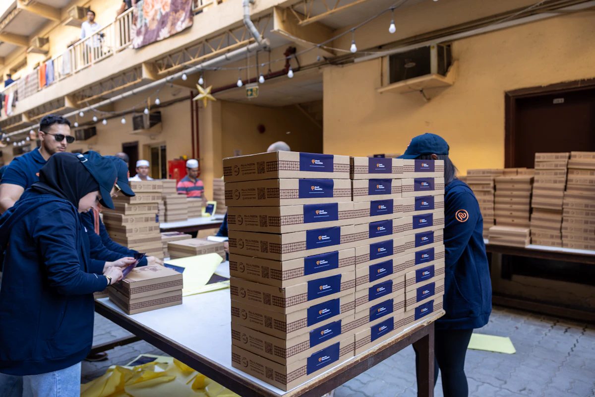 People packing boxes in a Dubai warehouse
